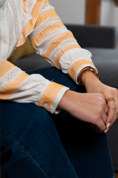 White and orange ruffled shirt